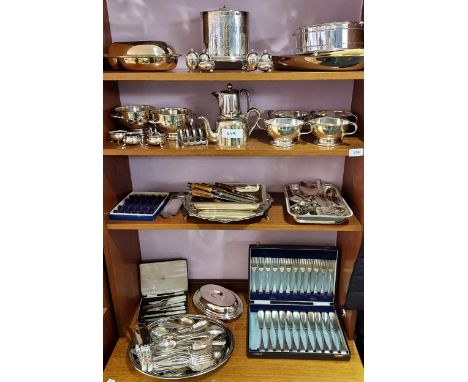 Four shelves of various silver plated and E.P Wares. To include cutlery, tea caddy, serving tureens and serving bowls. Also i