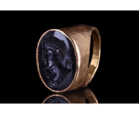 Ca. 100-200 AD. A wearable gold ring, Henig type I, with a round hoop widening at the shoulders, and a bezel with inset oval 