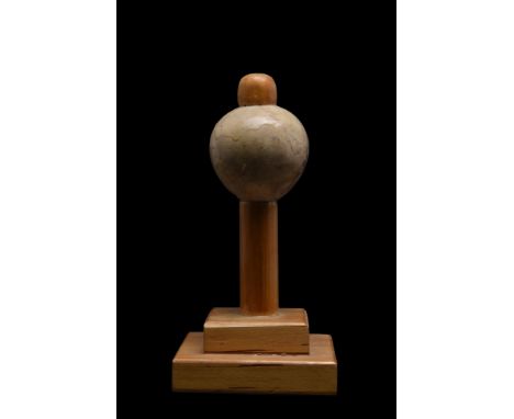 Pre-Dynastic, Ca. 3500-3000 BC. A rare piriform alabaster mace head with a cylindrical drill hole in the centre for attachmen