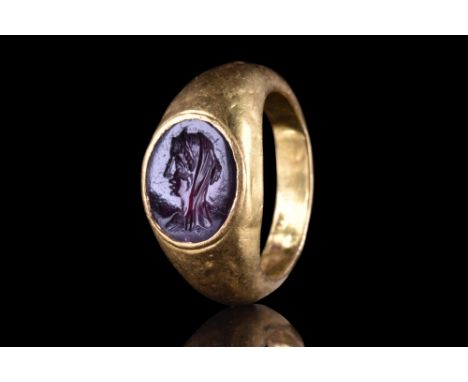 Ca. 100-200 AD. A stunning gold ring of Hening type III with a flat interior and rounded outside and the band gradually expan