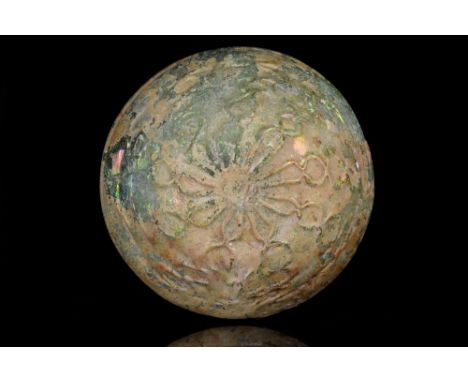 Ca. 100-300 AD. A rare, yellow-green coloured glass dish with a folded broad rim. The interior surface is plain whilst the ou