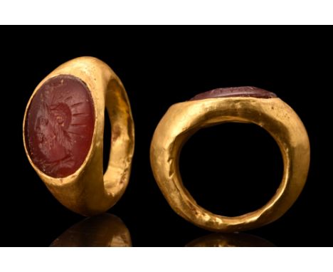 CA. 100-200 AD. Nicely carved Centurion with helmet, facing left in a carnelian intaglio of 20K gold, nicely detailed. The it
