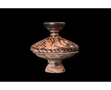 Ca. 340-325 BC. A terracotta red-figure lekanis consisting of a black-glazed footed dish with a flange to receive the lid tha