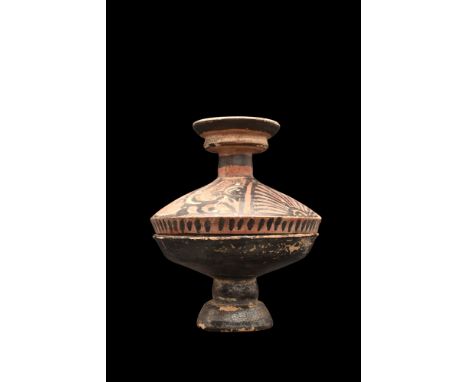 Ca. 340-325 BC. A ceramic lekanis of the red-figure lid with two female profile heads between palmettes and stylised volutes.