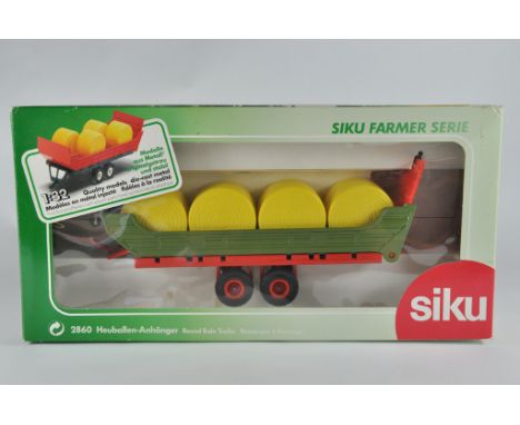 Siku 1/32 Round Bale Trailer. M in Box.