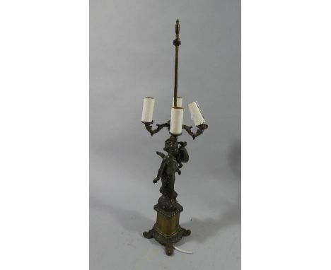 A Continental Brass and Spelter Figural Four Branch Table Lamp. Missing Shade, 79cm High 