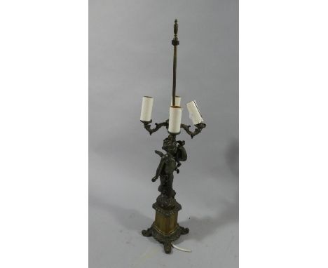 A Continental Brass and Spelter Figural Four Branch Table Lamp. Missing Shade, 79cm High 