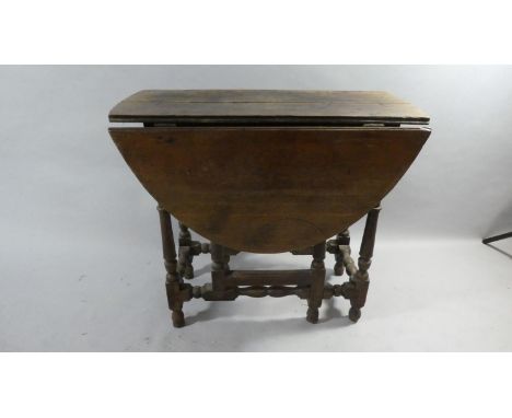 A Period Oak Drop Leaf Gate Legged Dining Table with Turned Supports, 84cm Long 