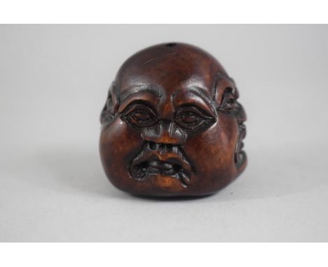 A Carved Wooden Netsuke in the Form of the Four Faces of Buddha, Signed to Base, 4cm High 