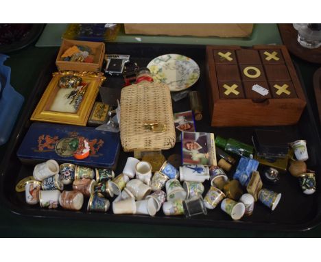 A Tray of Mixed Sundries to Include Souvenir Thimbles, Enamelled Badges, Pistol Cigaret Lighter, Wicker Covered Bottle etc 