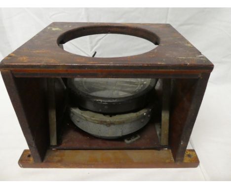 An RAF aircraft compass in wooden gimbled housing