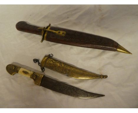 A Syrian dagger with brass mounted bone hilt in brass scabbard and one other modern dagger (2)