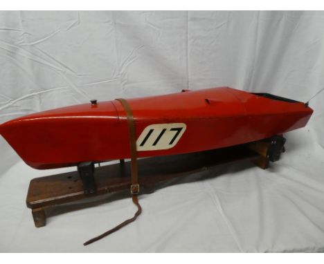 A fibreglass model racing boat based on a 1920's/30's design with petrol fuelled engine and remote control (minus handset), 3