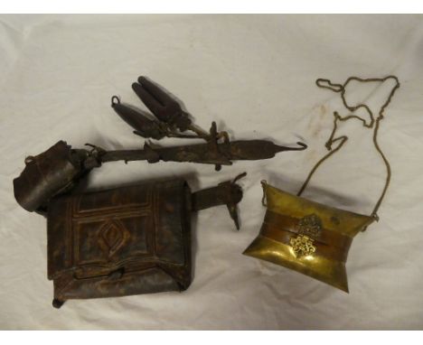 An old Arab leather gun belt with two pouches and various tools and a copper mounted brass Arabic purse