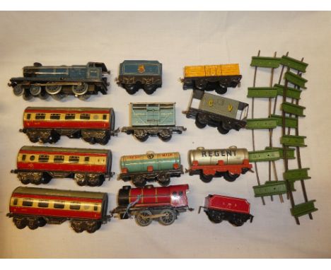 Chad Valley O gauge - Flying Scotsman locomotive and tender, three carriages, various rolling stock and green sleeper tin pla