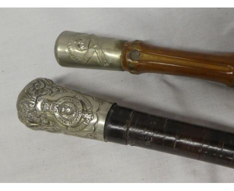 A Victorian swagger stick of the Royal Scots Fusiliers with nickel plated top and sectioned leather stem and one other swagge