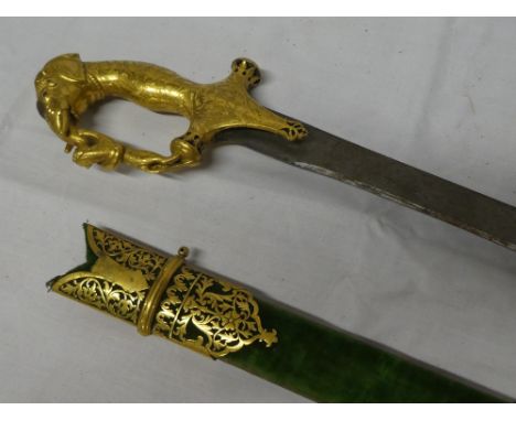 A rare Indo-Persian Tulwar sword with a 30½" single edged steel blade, ornate gilt hilt depicting a tiger and elephants head 