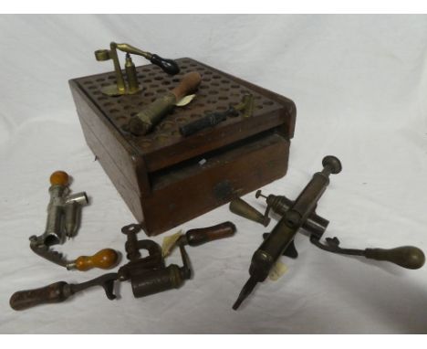 A selection of mainly 19th Century cartridge reloading equipment including unusual mahogany powder reloading frame by J Erski
