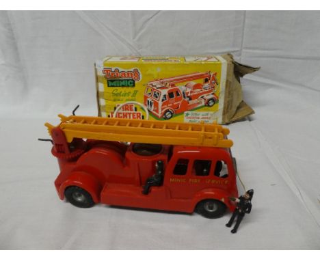 A Tri-ang Minic series 2 Fire Engine in original box complete with firemen (bell missing)