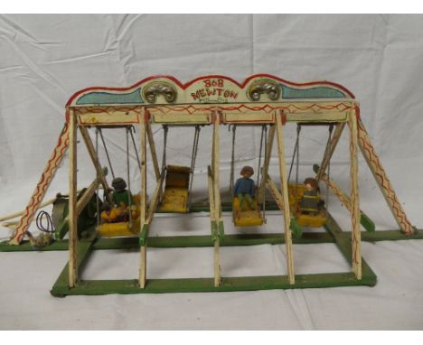 An old wooden scale built fairground swing boat ride (af)