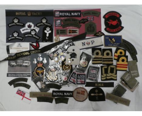 A selection of Royal Navy badges and insignia including Royal Yacht Naval cap tally, two pairs of Royal Yacht embroidered tit