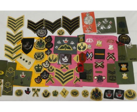 A collection of badges and insignia relating to the Light Infantry and Devon &amp; Dorset Regiment including various embroide