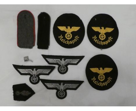Three original un-issued German "Reichsport" circular cloth badges; three un-issued German winged eagle badges, two epaulette