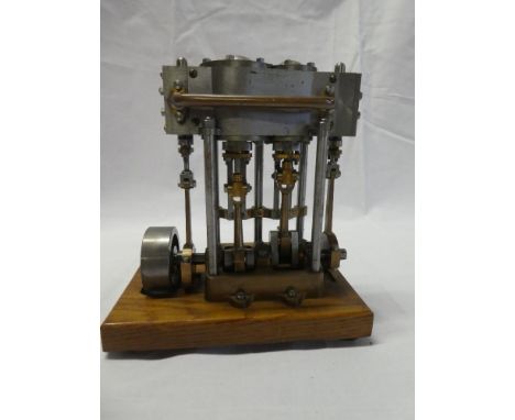 A scale built steel and brass vertical pumping engine, 6½" high