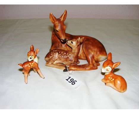 Three Goebel figurines consisting of two small 'Bambi' figurines and a Deer and Fawn figurine, the smallest figure is 2" tall