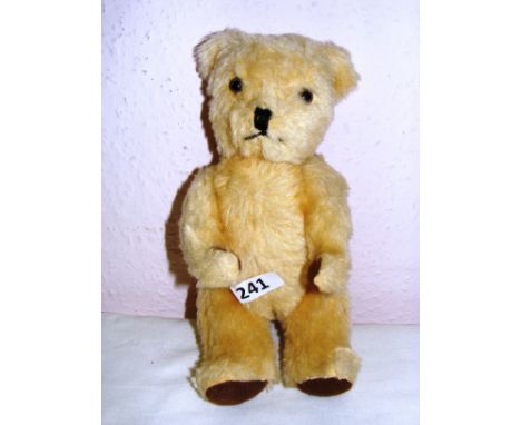 A vintage 'The Deans Gwentoy Group Bear' measuring 11" long. CONDITION REPORT: Label worn overall good condition. 