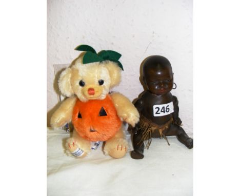 A Vintage Merrythought Cheeky Little Pumpkin bear and a 7" Black 399 Heubach Bisque Head baby doll. CONDITION REPORT: The bla