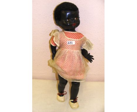 A vintage 1950's Pedigree black baby doll with voice box, marked 20t, 21" long. CONDITION REPORT: The voice is not working. O