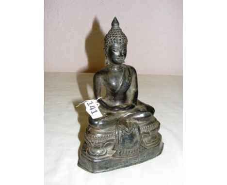 A large Chinese metal Buddha statue, measuring 9" tall. CONDITION REPORT: Good condition, free from damage.