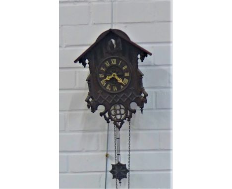 Carved wood cuckoo clock,  main body 35 x 34cm, complete with weights and chains  