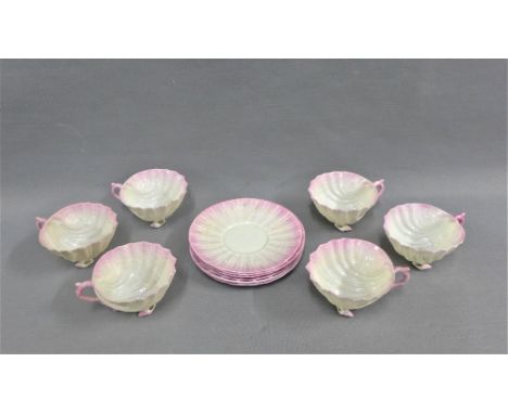 Belleek porcelain shell shaped teaset with pink rims, comprising six cups and six saucers with black printed back stamps