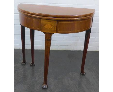 Mahogany and inlaid fold over card table, with paterae to the frieze and pad feet, 74 x 76cm 