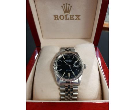 VINTAGE ROLEX OYSTER PEREPTUAL DATEJUST WATCH WITH BLACK DIAL 16030.&nbsp; COMES IN ORIGINAL BOX WITH MANUAL.&nbsp; IN WORKIN