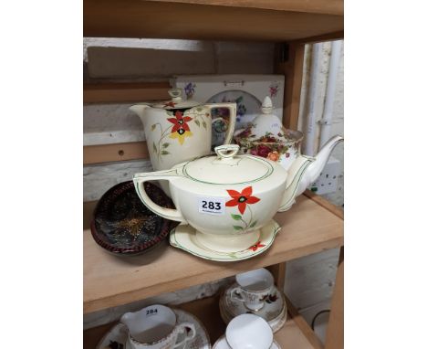 Shelf lot of tea and coffee pots 