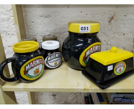 Shelf lot of old Marmite jars