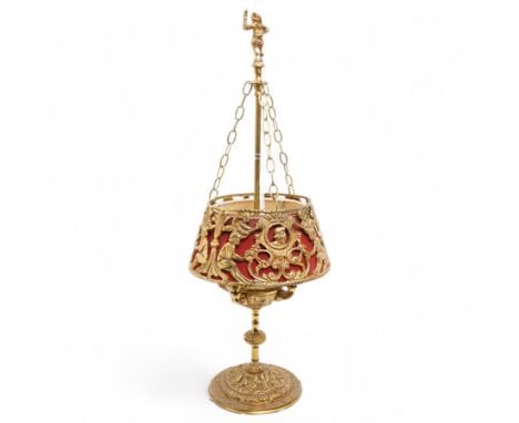 Brass four-light bouillotte lamp, decorated with ornate classical motifs, the finial formed as a gentleman, with red shade, H