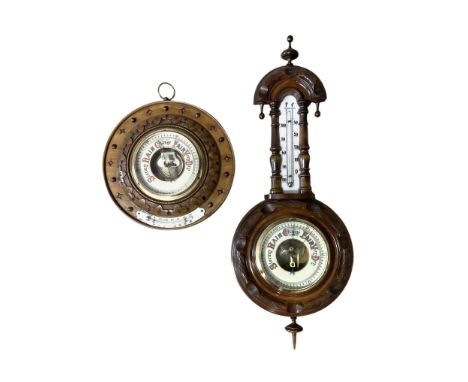 German- Late 19th century aneroid Barometer in a carved mahogany case with pendants and finials, 4” open dial register and me