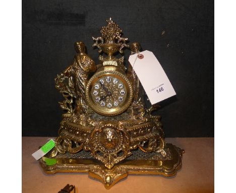 A heavy brass mantle clock with classical figures on rococo base