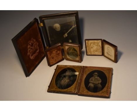 Photography - a 19th century ambrotype double-portrait, of an elderly couple, the sanguine wife colour-tinted, chased gilt sl