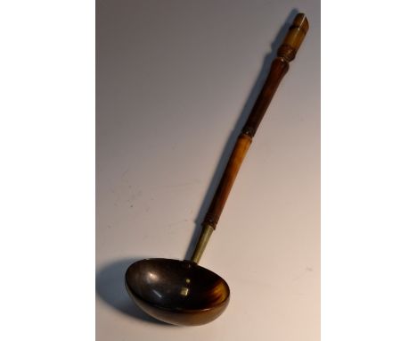 A 19th century Scottish cattle horn punch ladle, the sectional haft terminating in a whistle, 33cm long, c. 1830