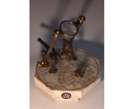 An early 20th marble and brass desk top meridian cannon, adjustable lens above a 9cm barrel, the octagonal base with and inci