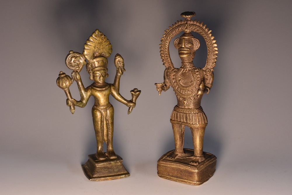 An Indian bronze votive figure, cast as a Hindu deity, spreading square