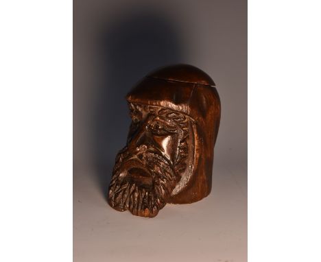 A 19th century Black Forest type novelty inkwell, carved as the head of a bearded gentleman, hinged cover, 8cm high, c.1890