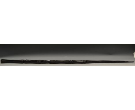 Tribal Art - an ebonised staff, carved with tribal elder and  bands, 96cm long, c.1900