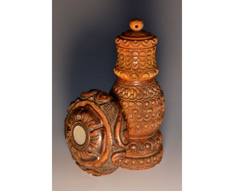 A 19th century coquilla nut circular snuff box, screw-fitting cover, carved throughout with acanthus and inlaid with mother-o