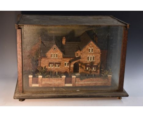 A late Victorian cork architectural diorama, the model as a substantial suburban villa, set in walled grounds, glazed case, 3